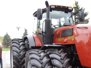 Red tractor maintained with Kelly Lubricants, Oils, and Greases.